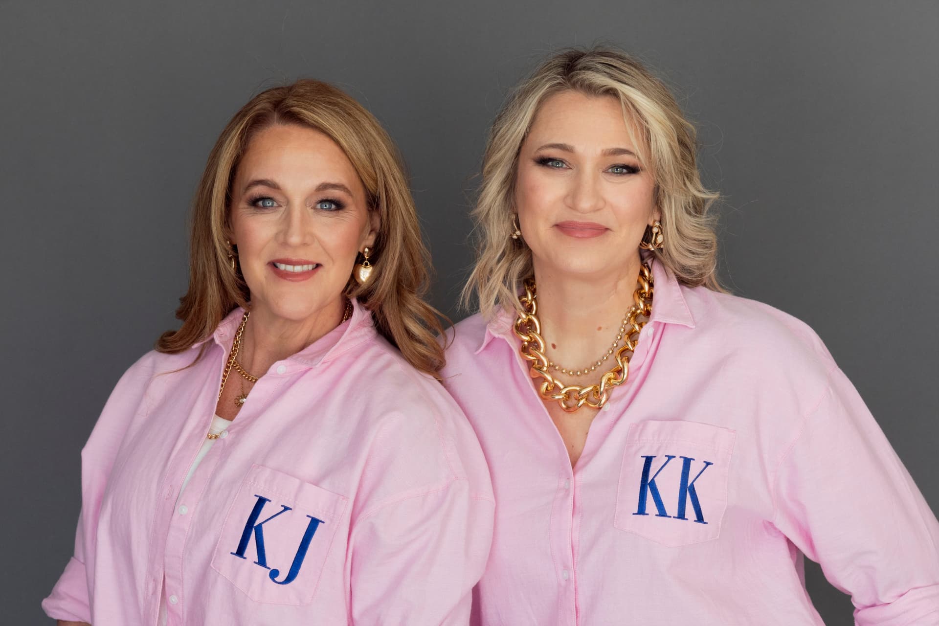 Kristen Campbell and Kristin Argento wearing personalized pink shirts