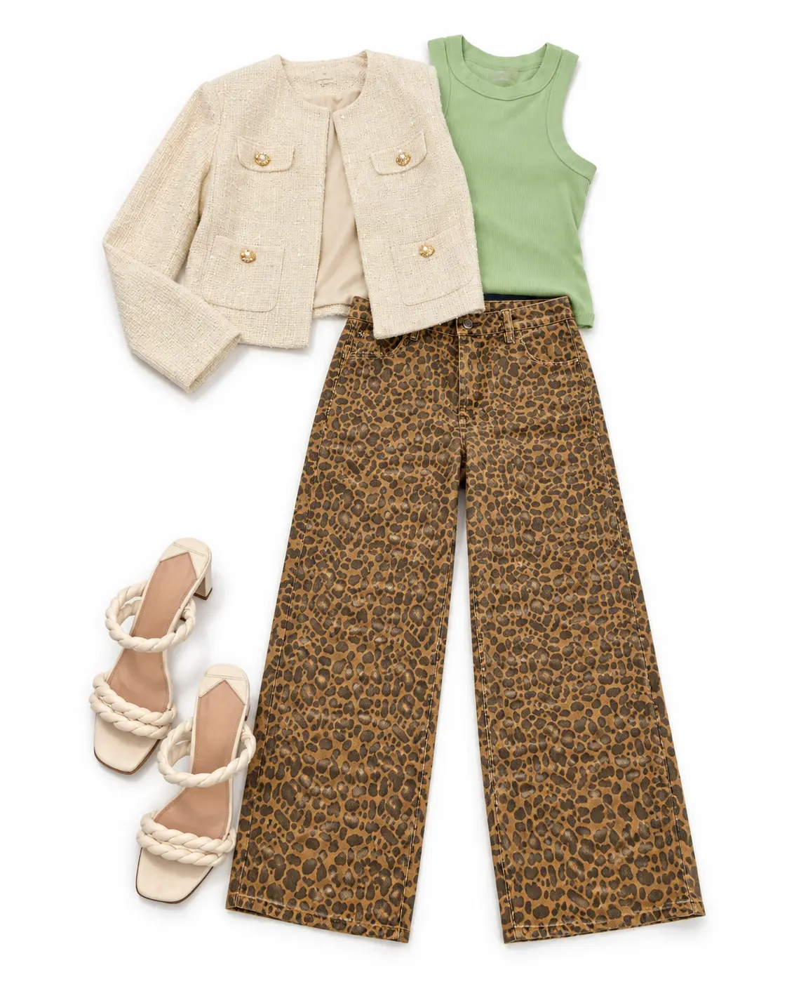 A styled outfit: a cream tweed jacket with gold buttons over a sage green tank, leopard-print wide-leg jeans, and cream braided-strap heels